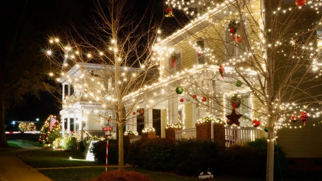 Home decorated with Christmas lights at night